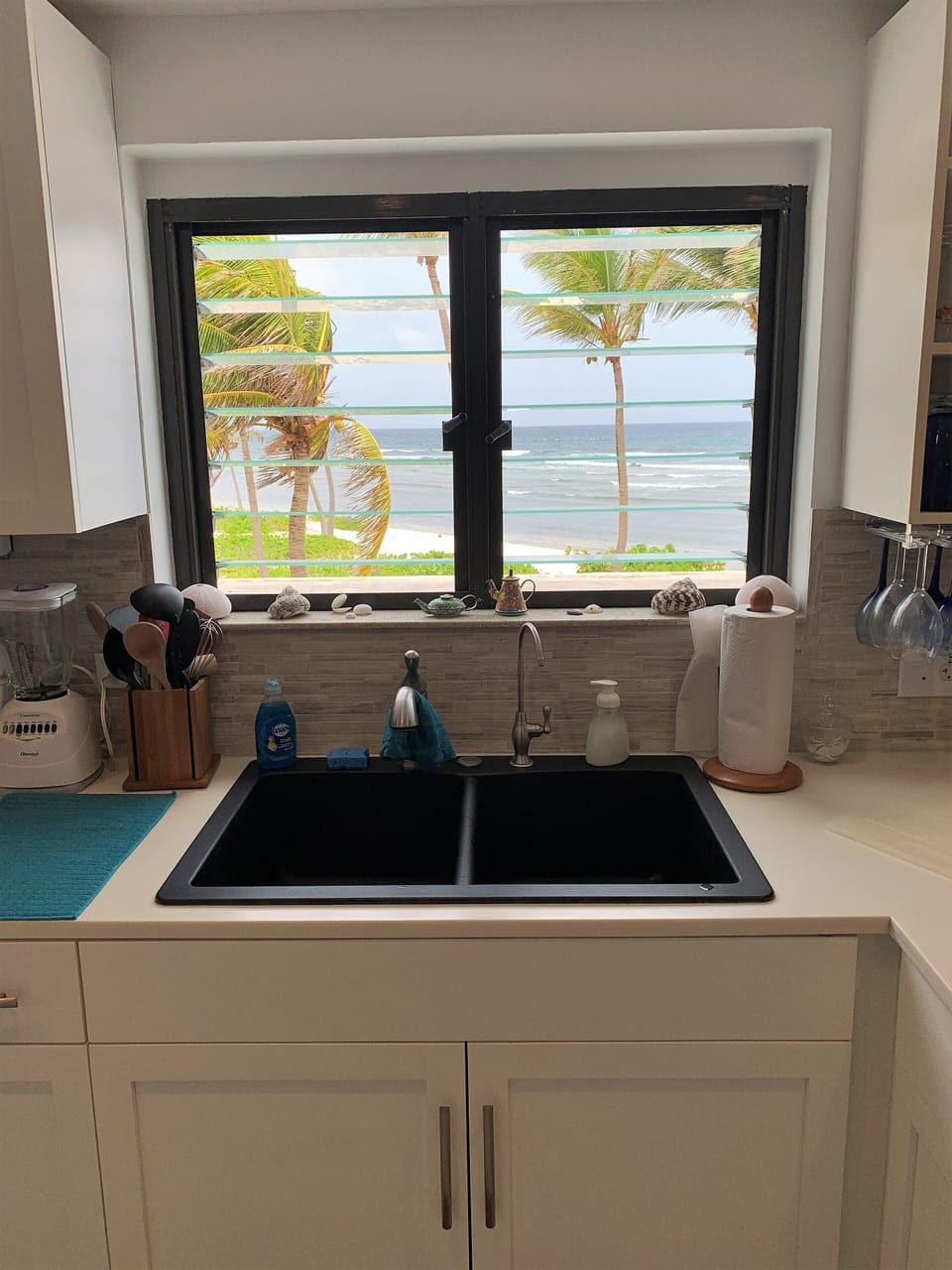 View of the ocean from the kitchen sink
