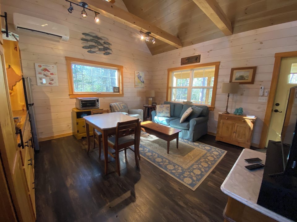 Living area - Loveseat w/side chair & 4 dining chairs. Extra chairs on reques