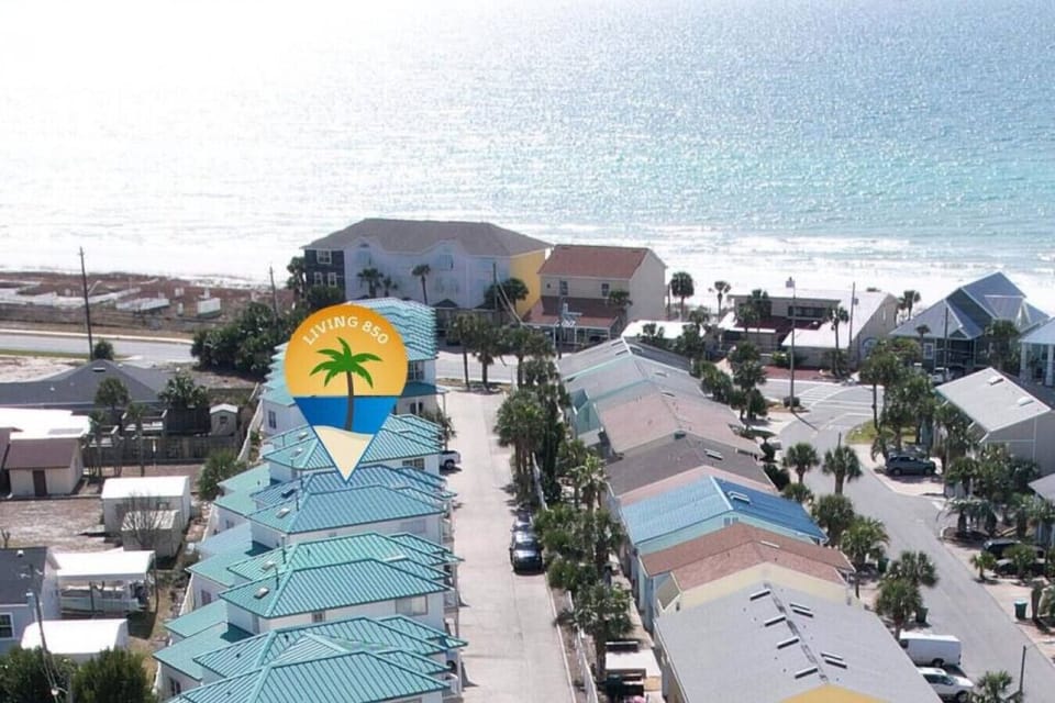 Just steps from sugar-white sands and endless emerald Gulf views