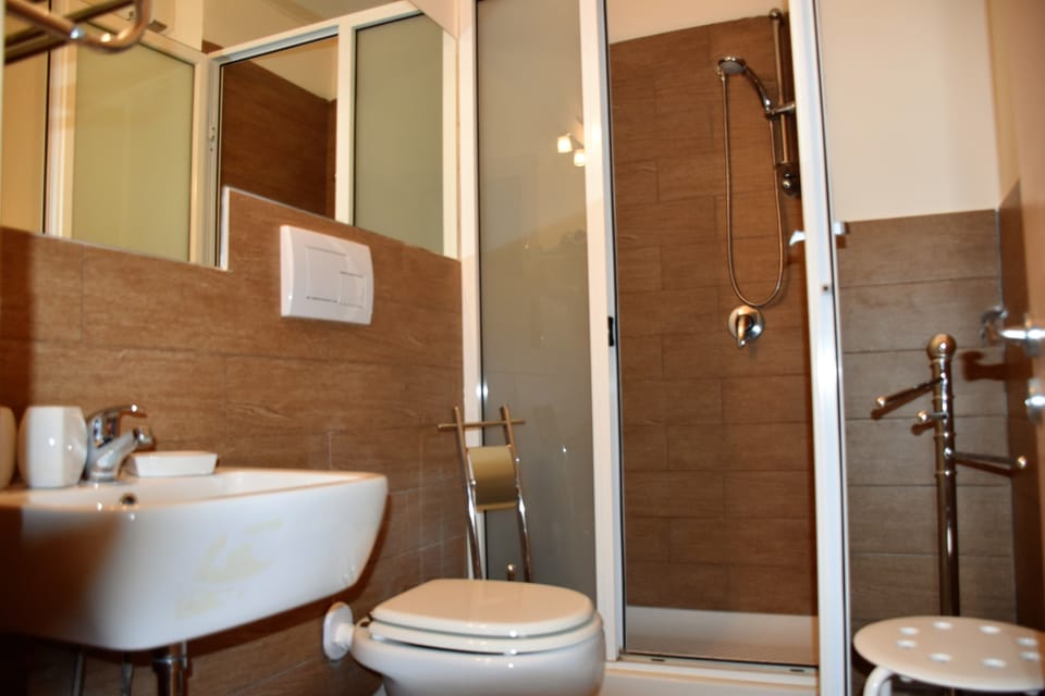 Basic Triple Room, Private Bathroom, Tower | Bathroom | Shower, rainfall showerhead, free toiletries, hair dryer