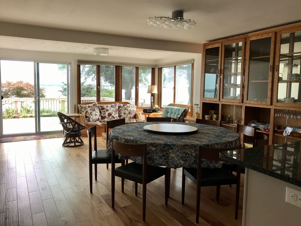 Living room/dining room with river view