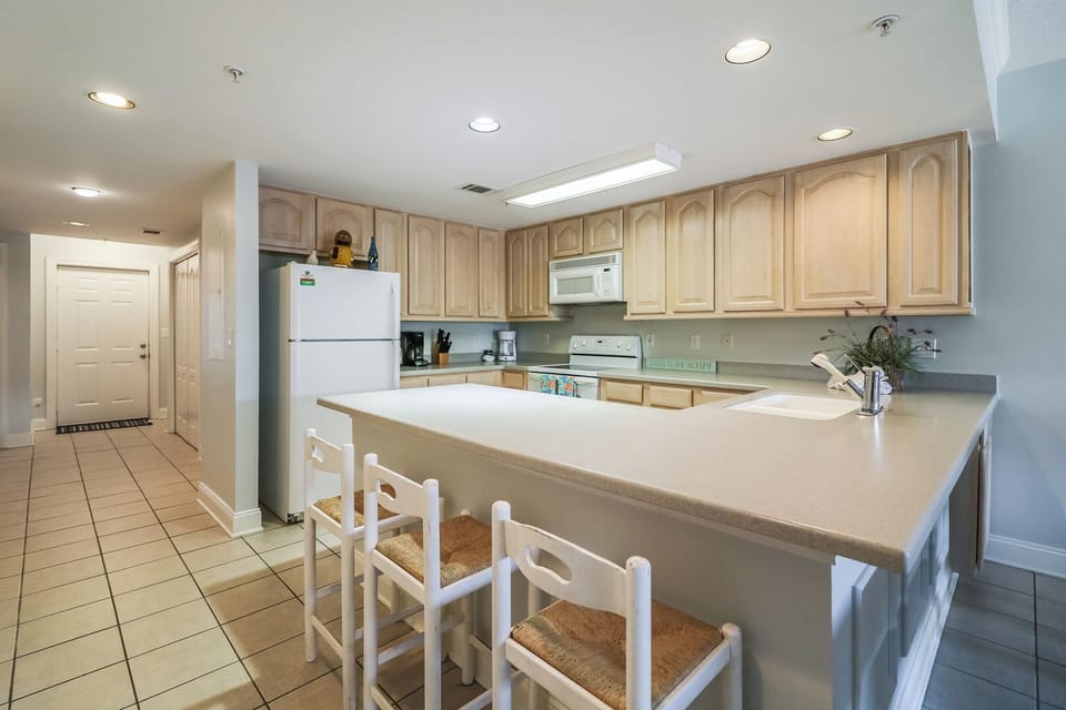 Kitchen with a standard drip coffee maker provided