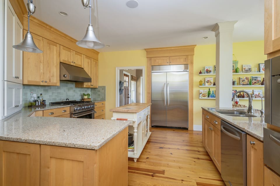 Modern kitchen with stainless steel appliances.
