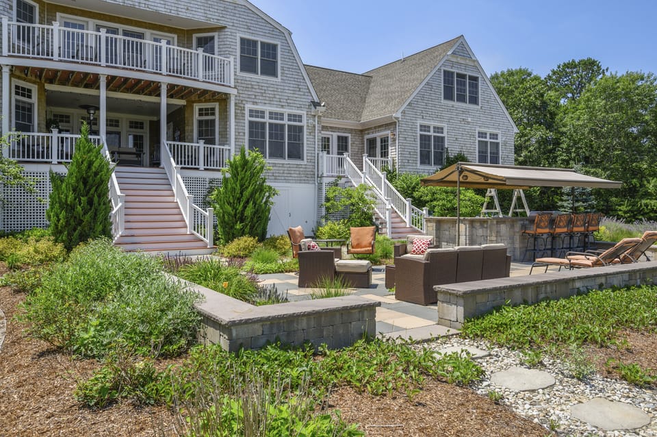 Outdoor patio seating with grill and bar.