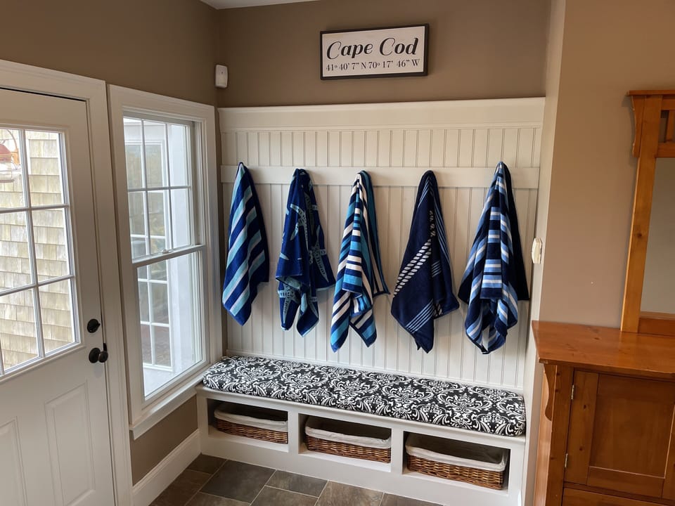 Plenty of hooks and storage for beach towels, sandals, and more.  