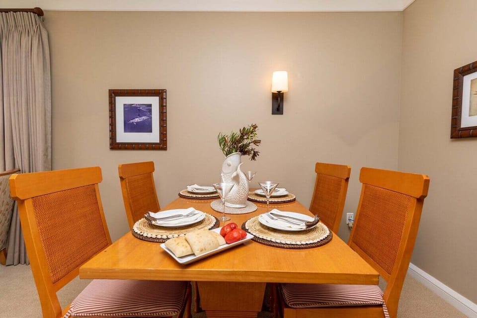 Simple dining setup with seating for four and neutral décor