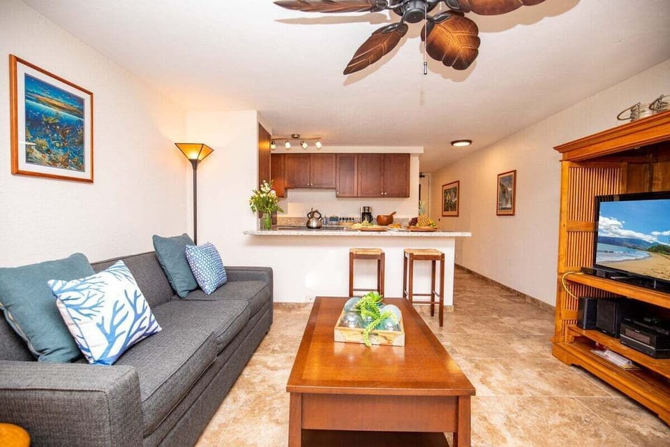 Open-concept sitting area with a sleeper sofa and vibrant décor, perfect for unwinding after a day of adventure