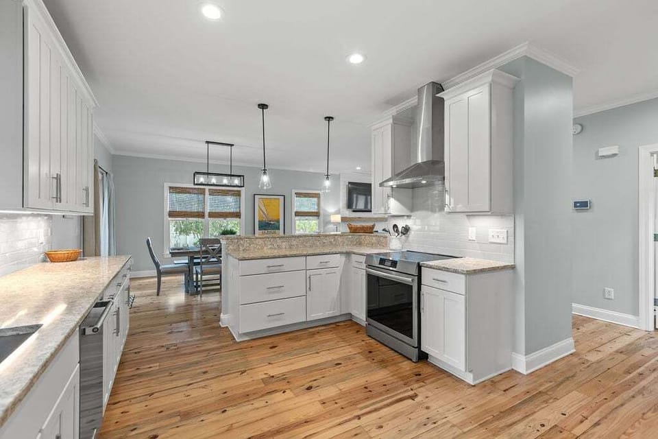 Large kitchen with stainless steel  appliances.