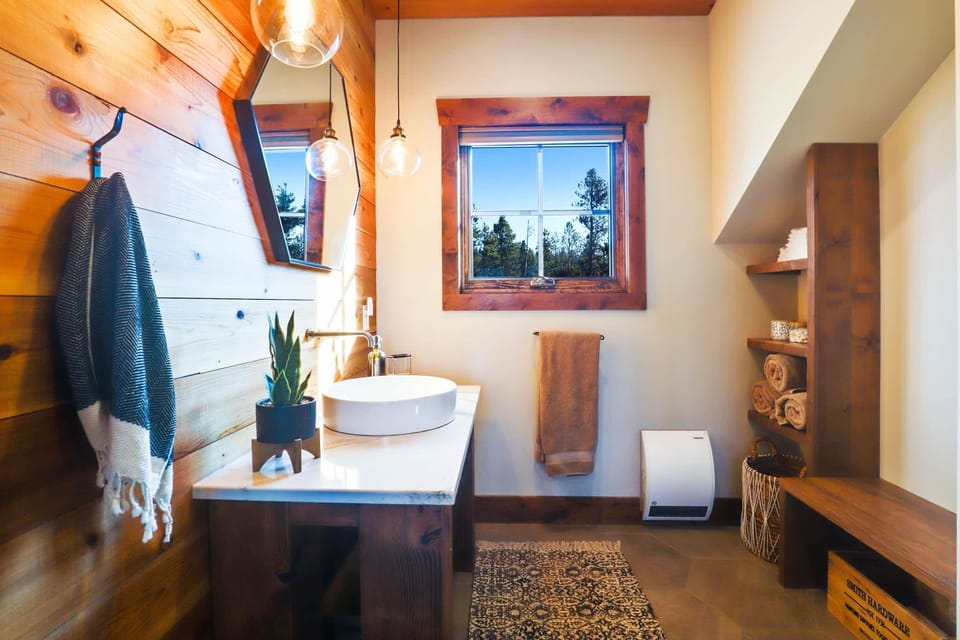 Upper level bedroom with king bed and en suite bathroom with a walk-in shower
