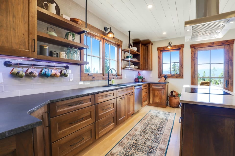 Fully equipped kitchen with a table with booth seating