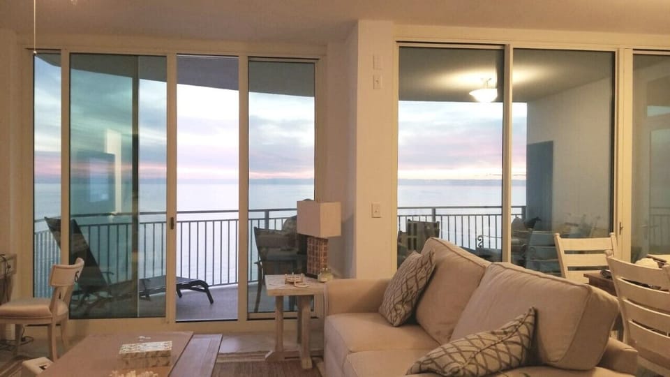 Ceiling to floor windows with ocean view across common areas