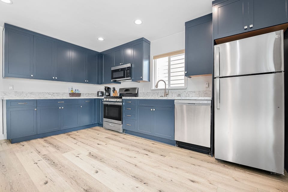 Fully renovated kitchen with modern appliances and ample counter space
                