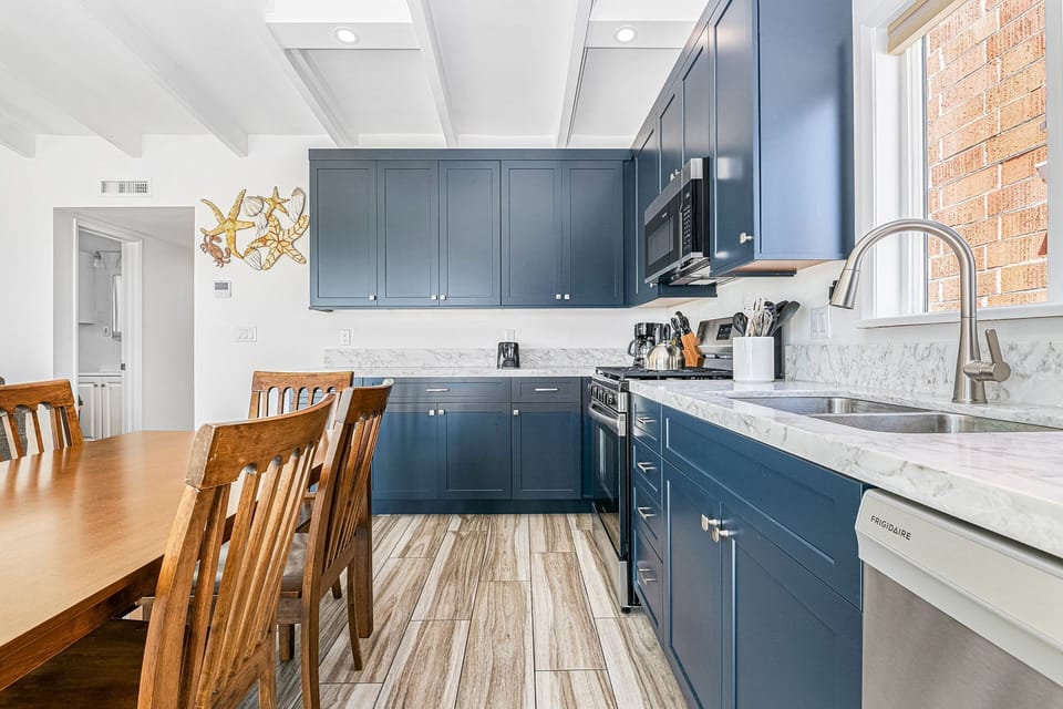 The bright, updated kitchen with dining space is perfect for easy meals at home.
                