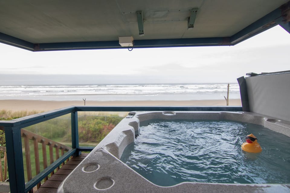 Relax in the hot tub right on the deck with ocean views!