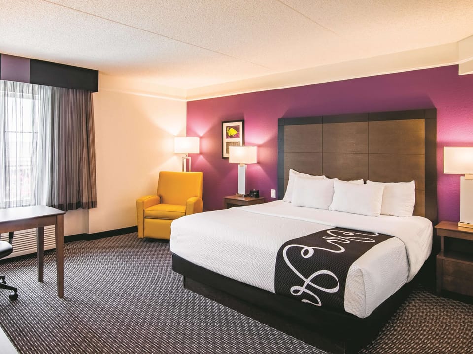 Premium bedding, desk, laptop workspace, iron/ironing board