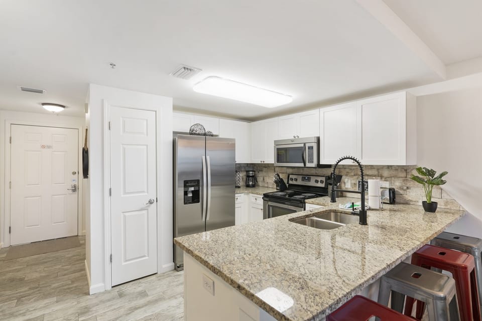 Fully stocked kitchen with new stainless steel appliances