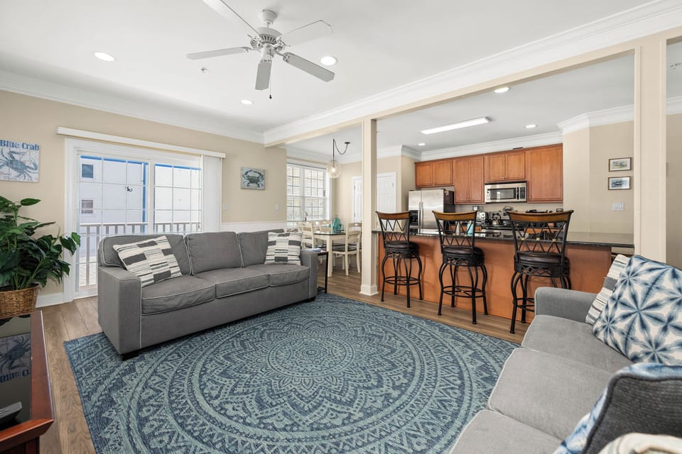 Bright open living space with breakfast bar, dining nook, and natural light