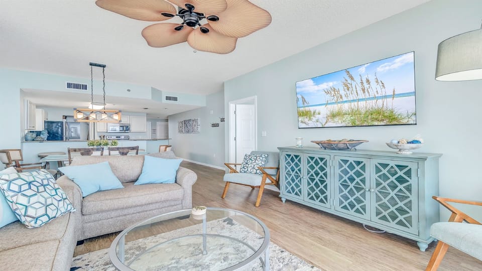 Experience seamless coastal living in this open-concept design, where the living room, dining area, and kitchen flow effortlessly into one inviting space. Perfect for entertaining, family gatherings, or simply enjoying the bright, airy ambiance.