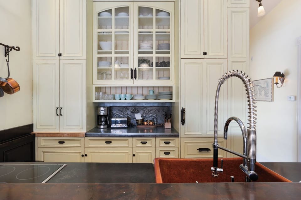 Fully stocked kitchen with top of the line appliances & comfortable bar seating!
