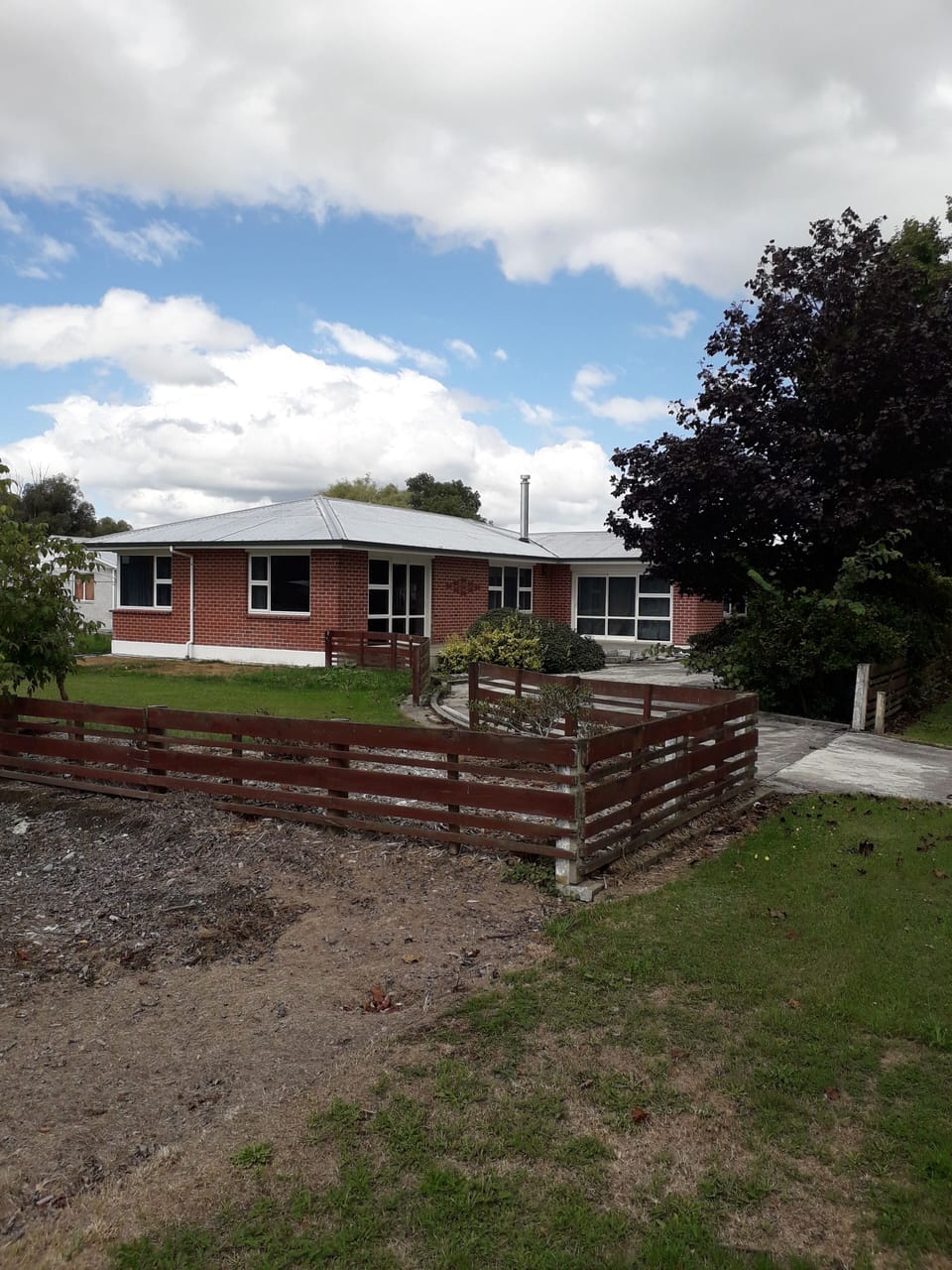 large lawn and garden with front patio