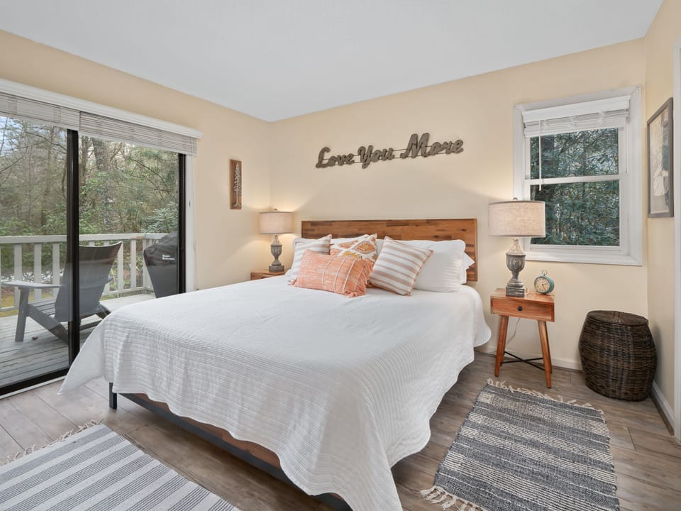 King-sized bed with entrance to the back deck. Not shown full dresser and TV.