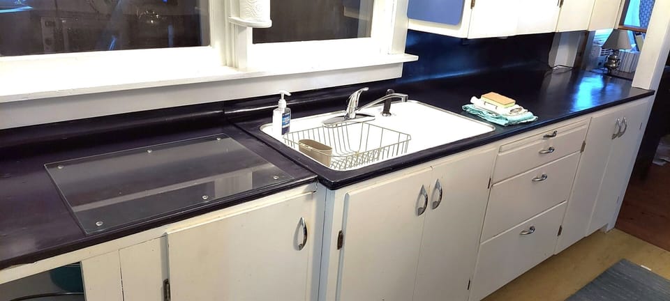 Older kitchen spruced up. No dishwasher, new appliances, reno being planned