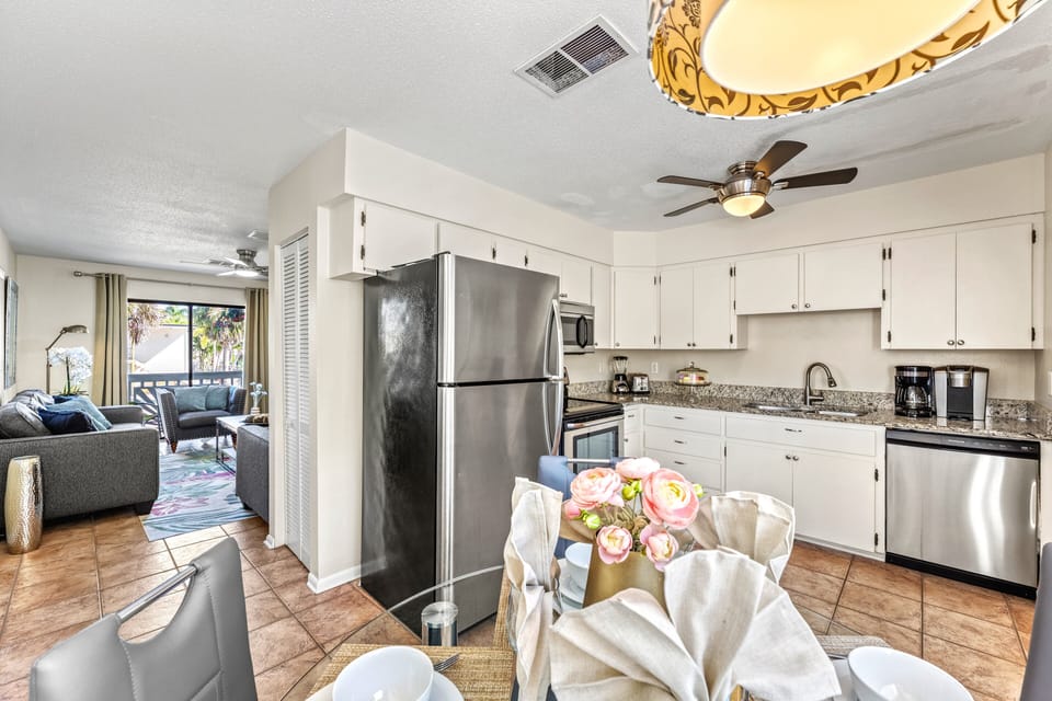 Classic coastal design meets full functionality in this warm, welcoming kitchen space.