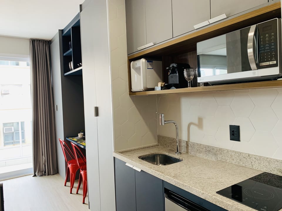 Executive Studio Suite | Private kitchen | Mini-fridge, microwave, stovetop, toaster