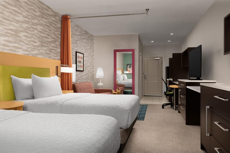 Hypo-allergenic bedding, laptop workspace, blackout drapes