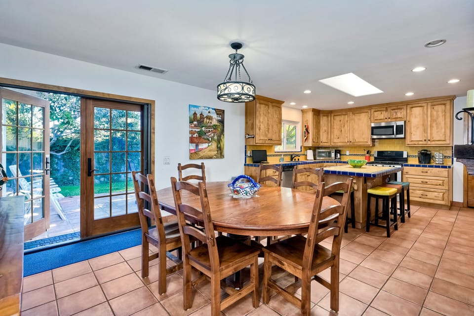 Kitchen dining offers seating for six at the table and another four at the island.
