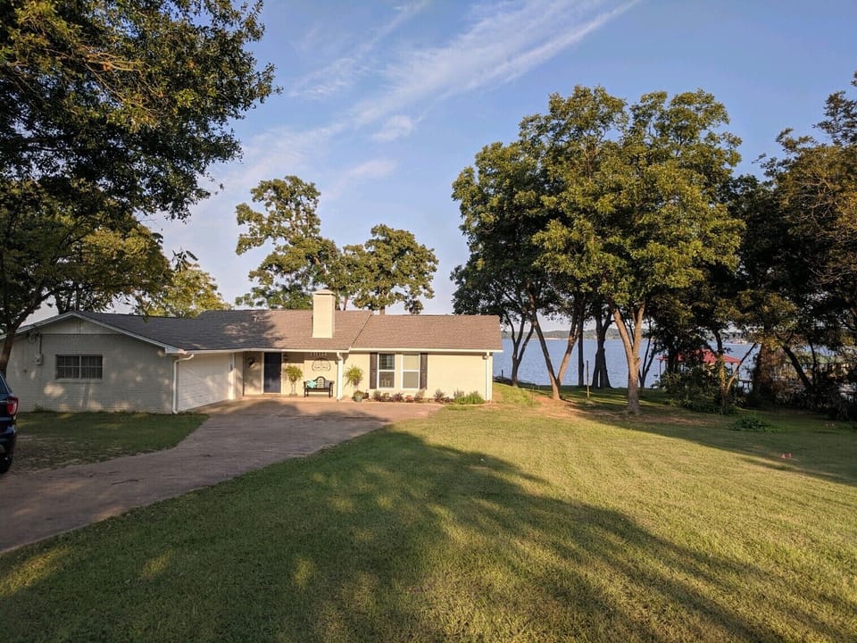 House sits on 2 large fenced in lakelots with plenty of parking for trucks/boats