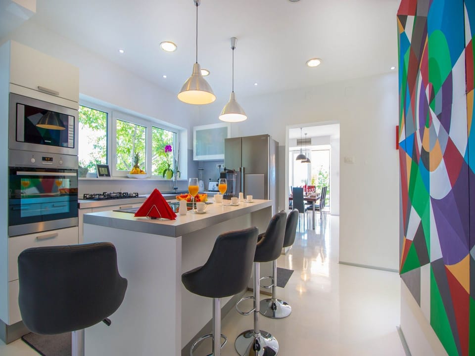 Villa | Private kitchen | Fridge, microwave, oven, stovetop