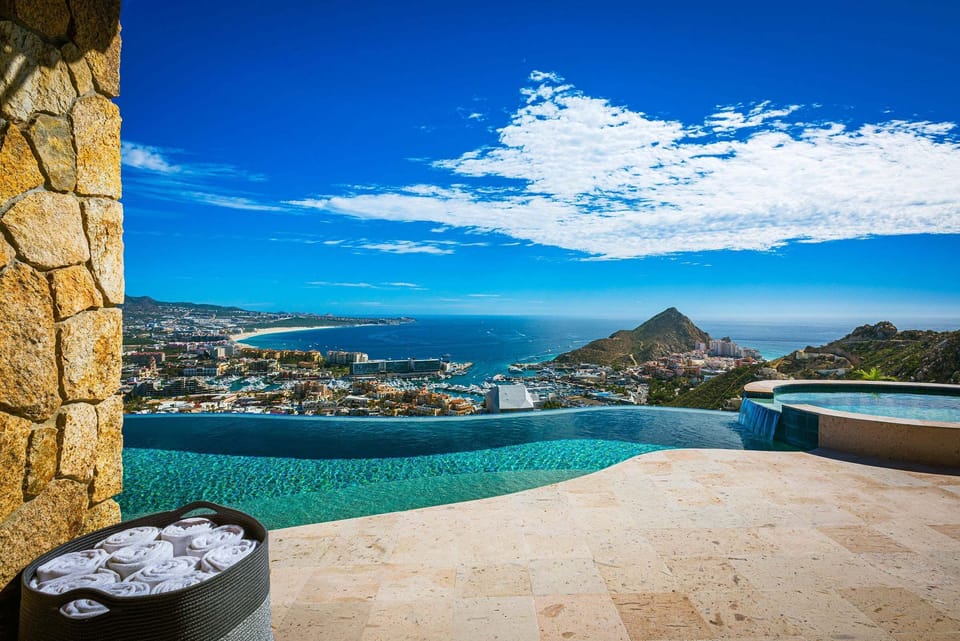 The infinity edge of the pool at Casa Cielo at Pedregal, dropping away toward Cabo San Lucas and Land's End.