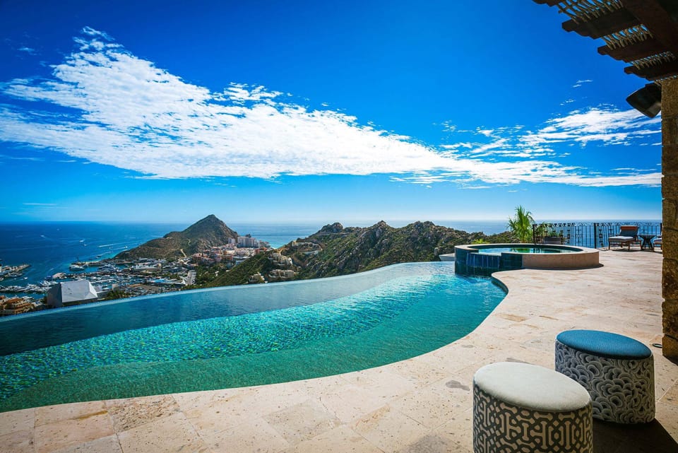 The infinity pool at Casa Cielo at Pedregal, with the hillside of Pedregal and the rock of Land's End beyond.