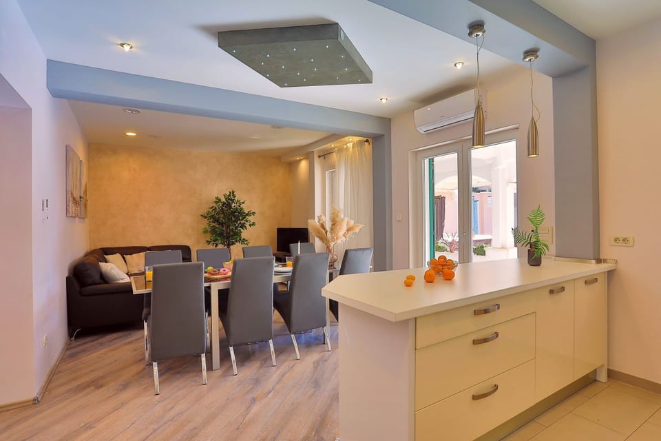 Fully equipped kitchen and exit to the pool area