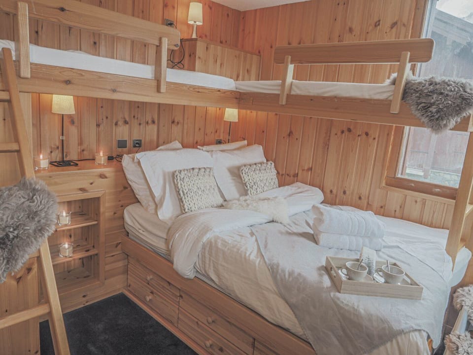 Family bedroom with a double bed and 2 single beds over