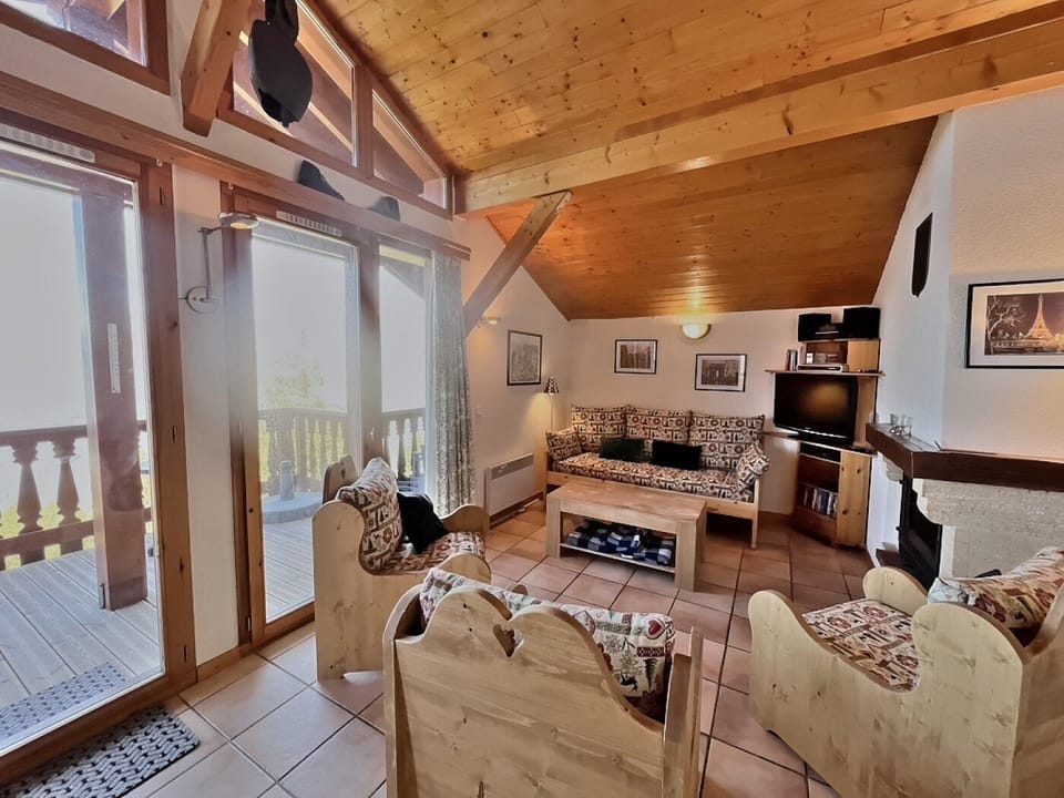 Lounge area with access to balcony with stunning views across the Tarentaise Valley