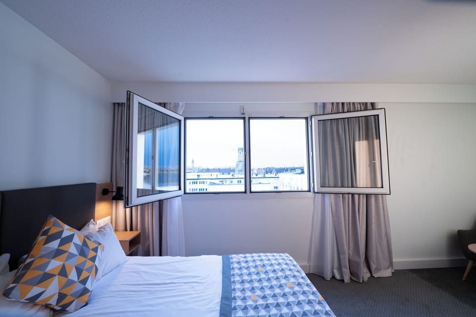 Minibar, desk, blackout drapes, iron/ironing board