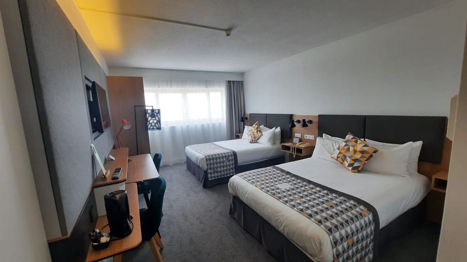 Minibar, desk, blackout drapes, iron/ironing board