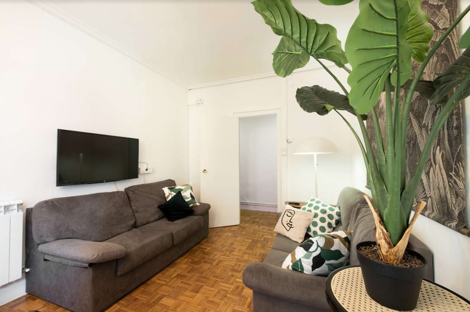 Lounge with TV, sofas and dining area