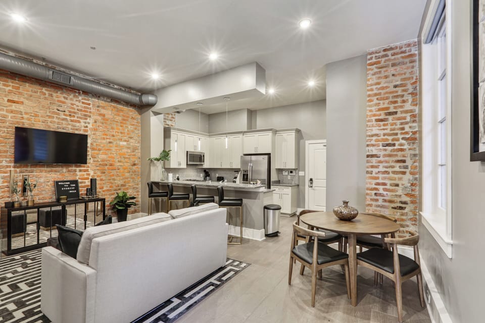Open concept living, kitchen, and dining area with ample comfortable seating for you and your guests. 50” Samsung Smart 4K TV with streaming apps and DIRECTV. Sofa converts to a full-size sleeper. Dining table for four.