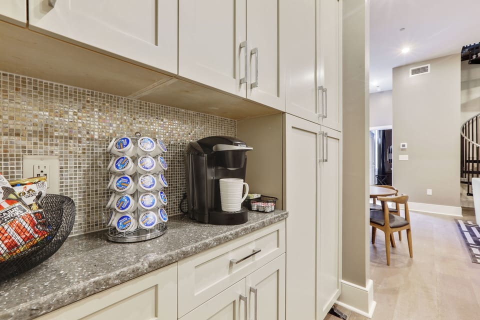 Keurig with complimentary (limited) supply of K-cups, sweetener, and creamer. Yum! Stocked in Every Home.