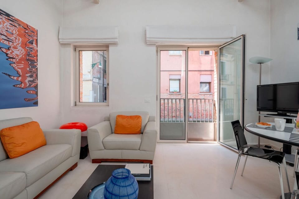 Apartment, 1 Bedroom | Living room | Flat-screen TV
