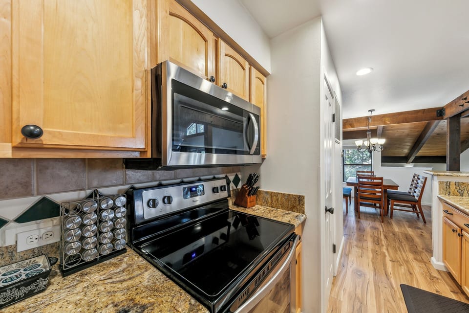 Your fully equipped kitchen features modern appliances and granite countertops, perfect for preparing meals during your stay.