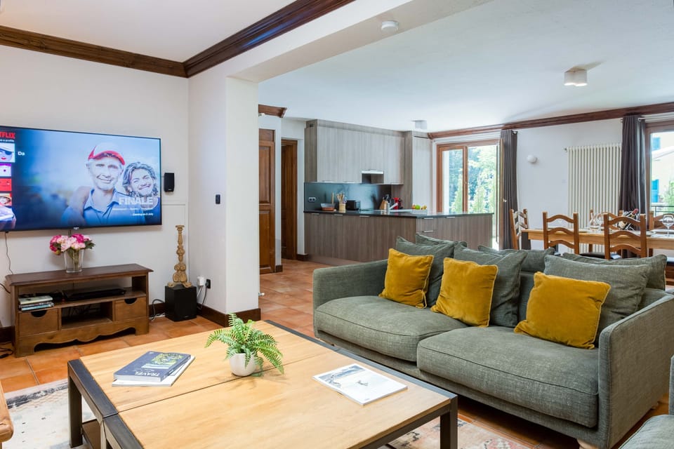 Cosy lounge area with large TV and sofa bed