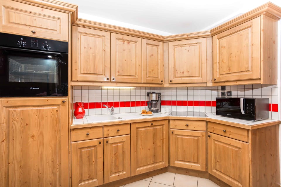 Kitchen is well-equipped with many compact appliances