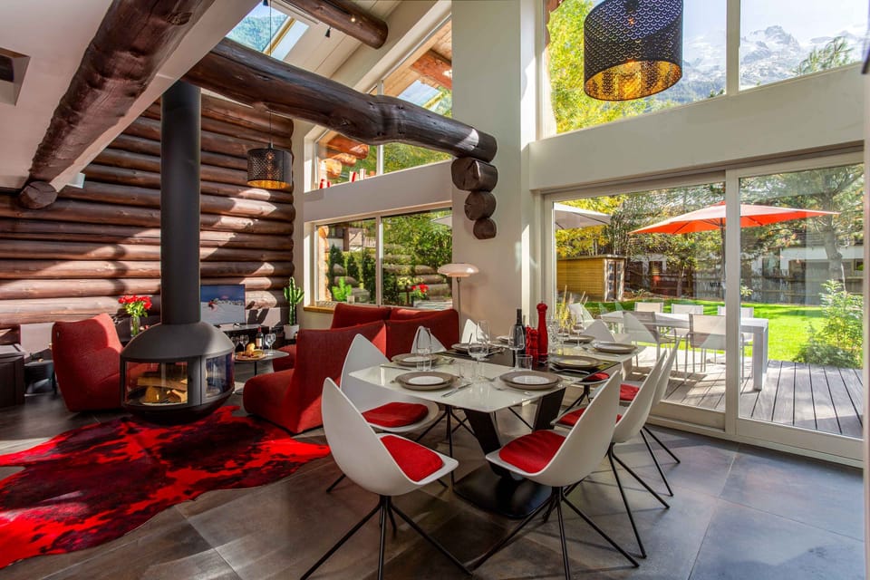 Open plan living dining room with large windows