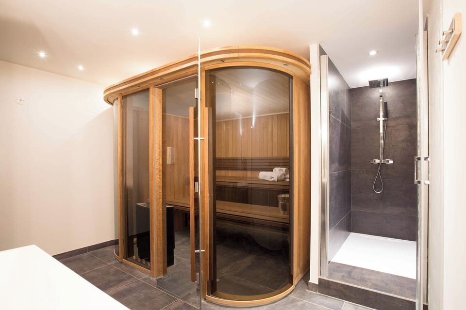 The sauna room on the lower ground floor also has a shower and double sinks