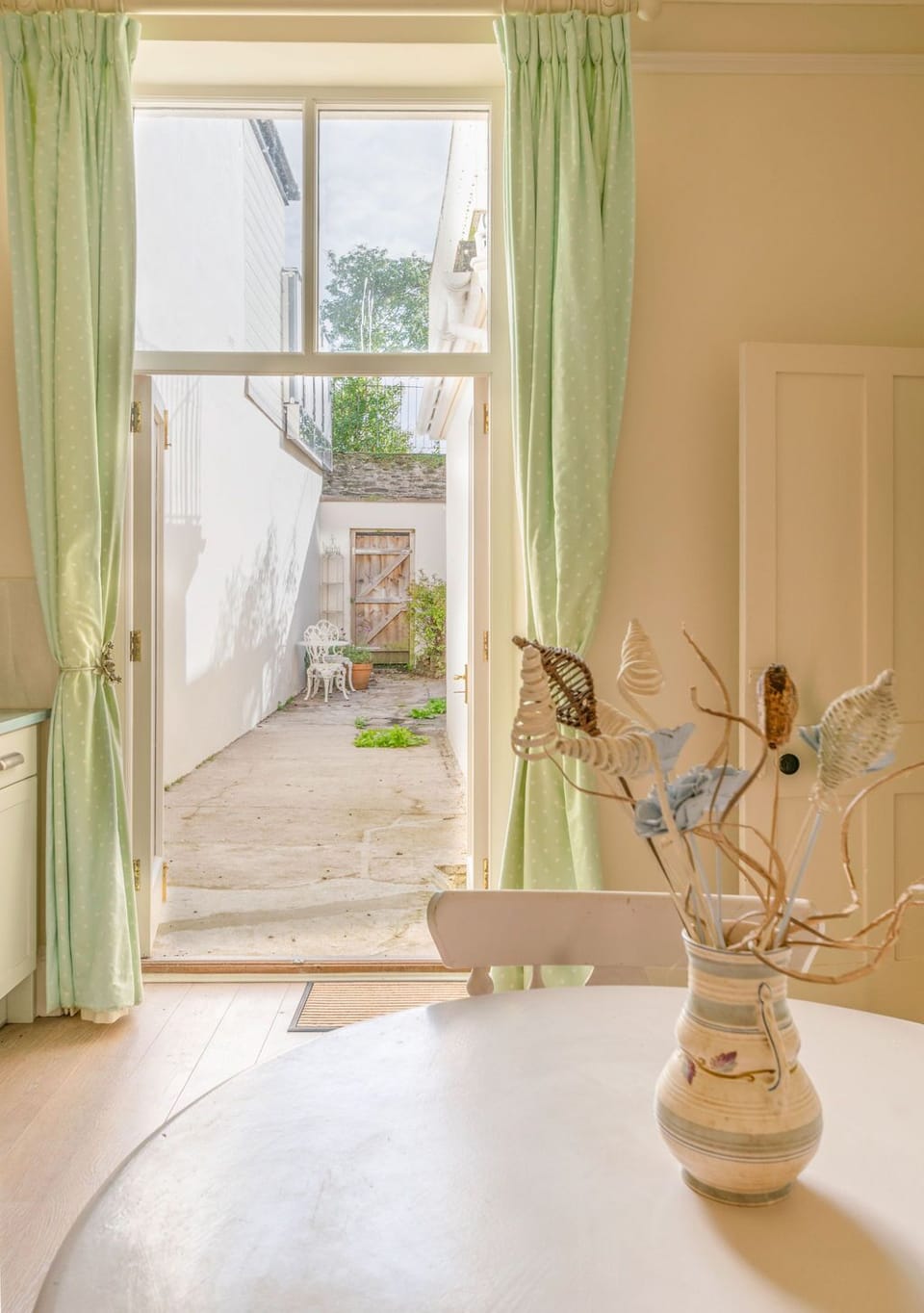 The kitchen leads to a large courtyard area