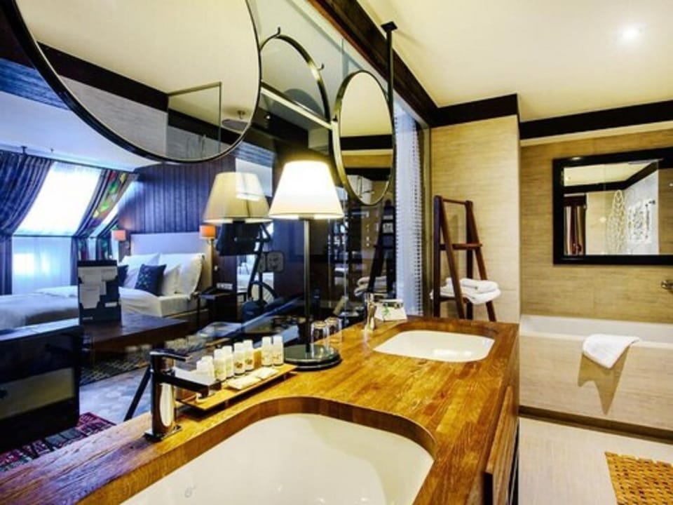 Senior Suite | Bathroom | Rainfall showerhead, designer toiletries, hair dryer, bathrobes